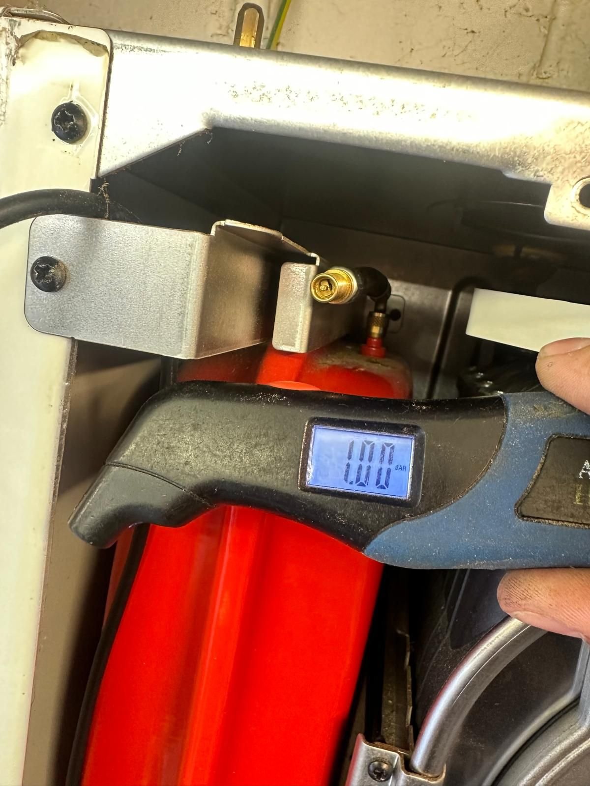 Checking boiler expansion vessel pressure during an annual service