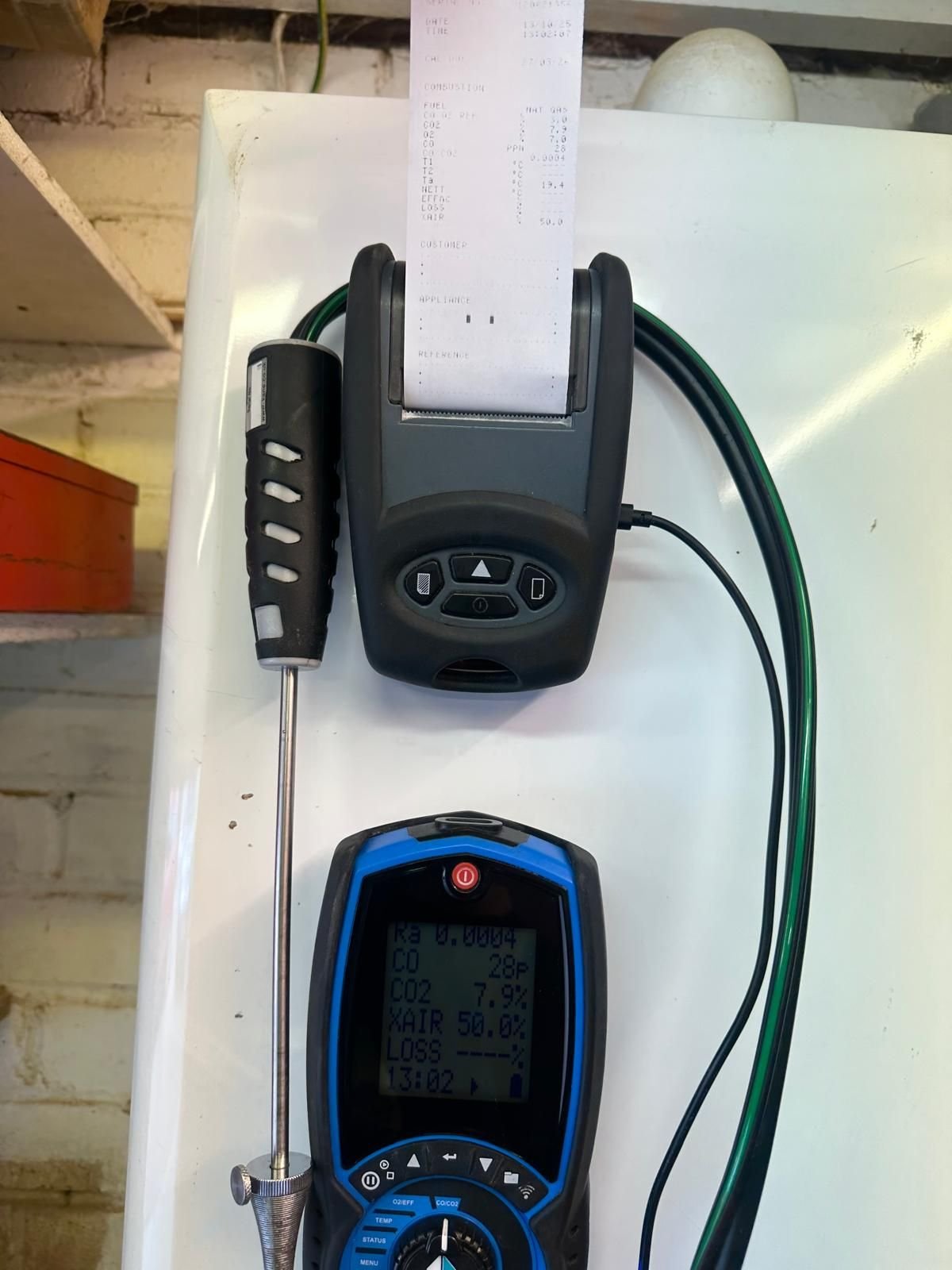 Flue gas analyser in use during a boiler safety check