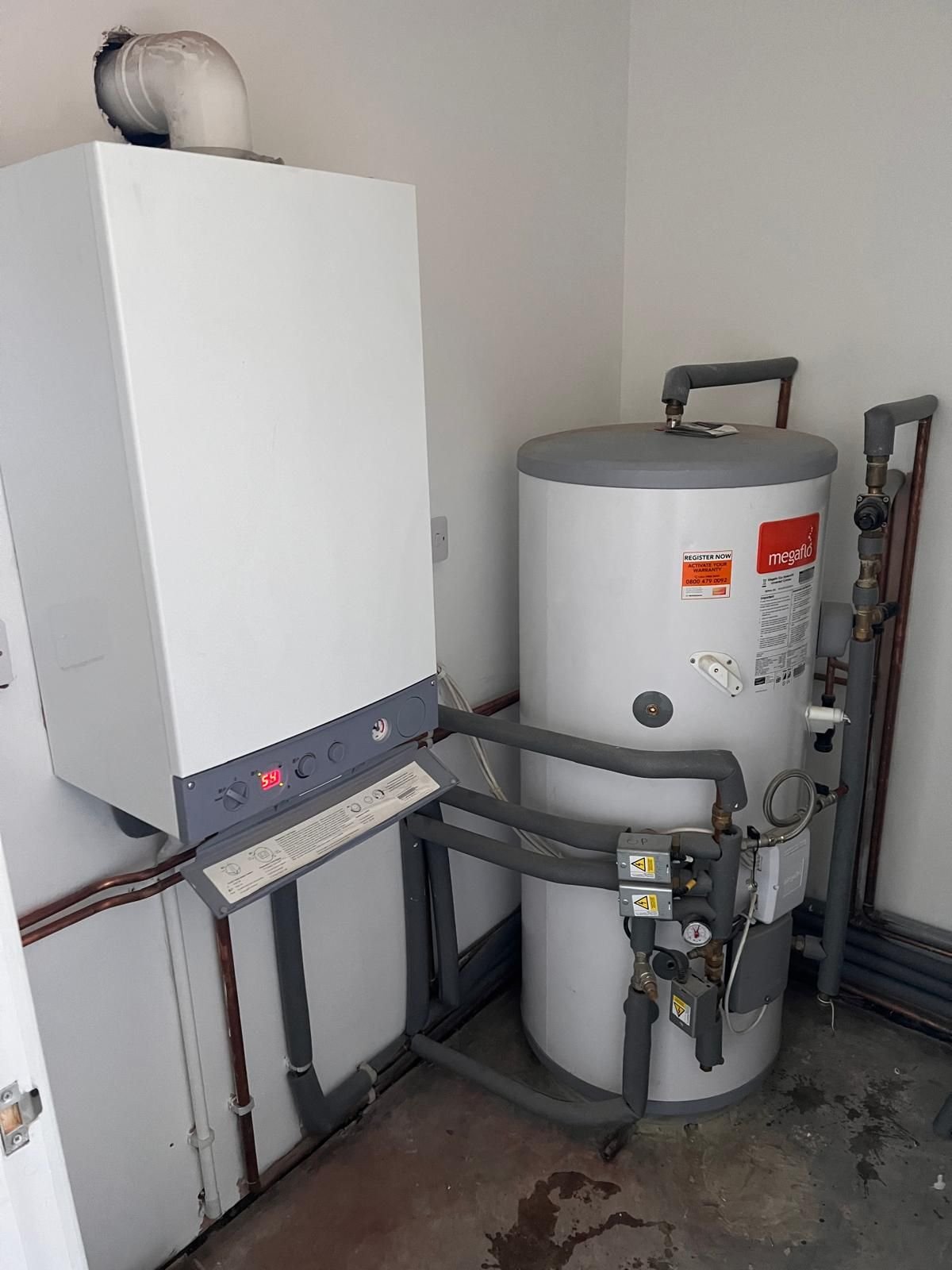 Megaflo unvented hot water cylinder installed beside the boiler