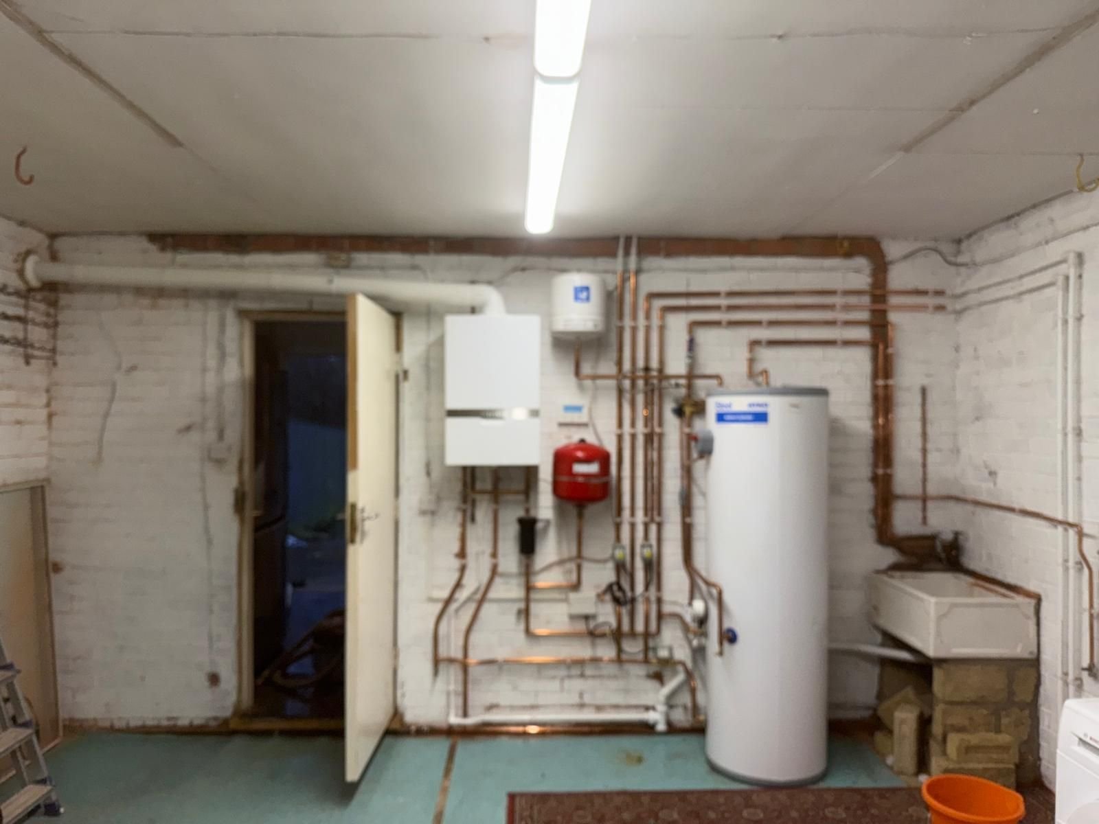 Full system boiler and unvented cylinder installation with neat copper pipework