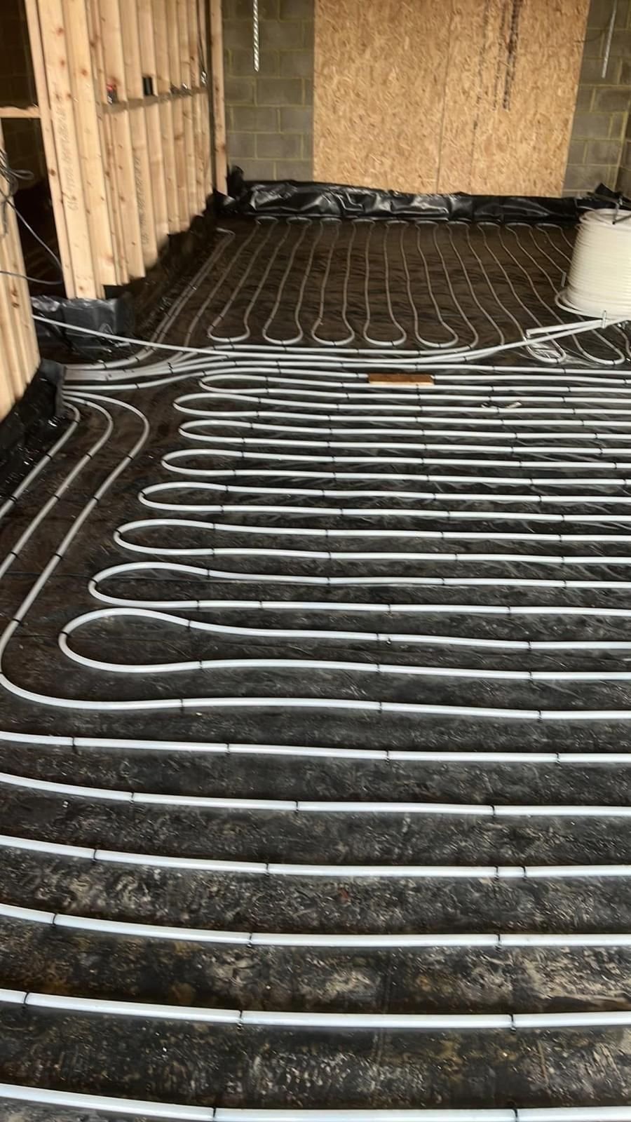Underfloor heating loops installed across a new extension floor