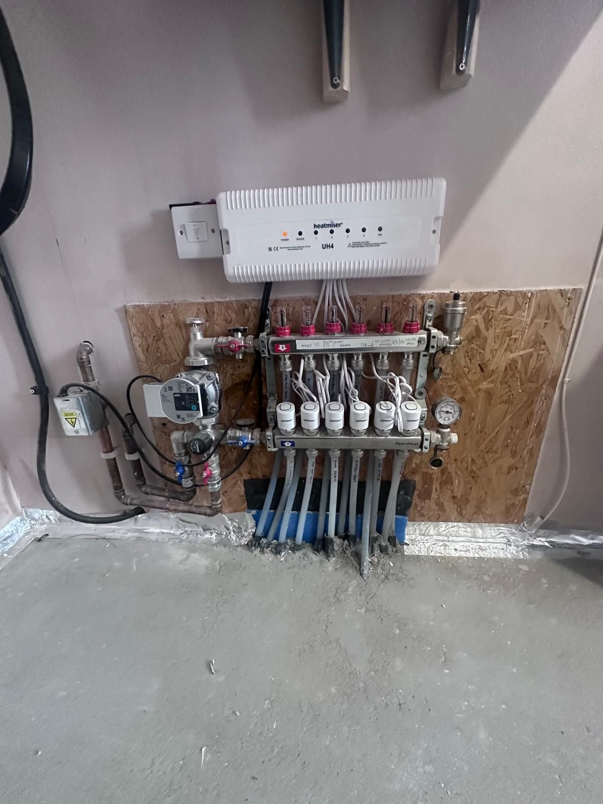 Underfloor heating manifold installed and connected