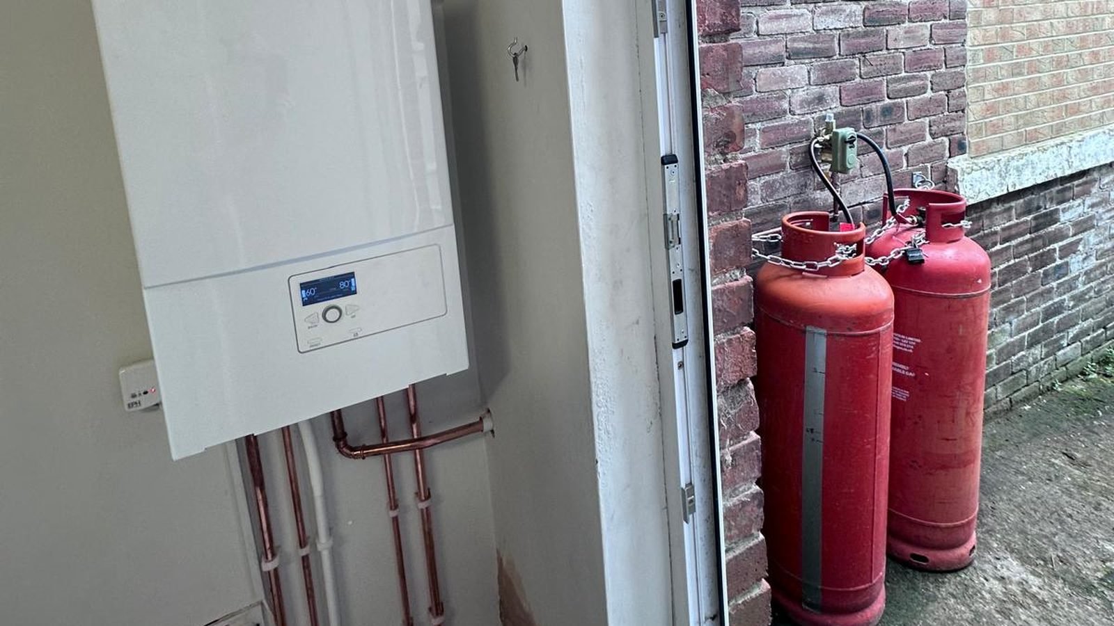 ATAG LPG boiler installed by Connected Gas & Heating with two red LPG cylinders outside a County Durham home